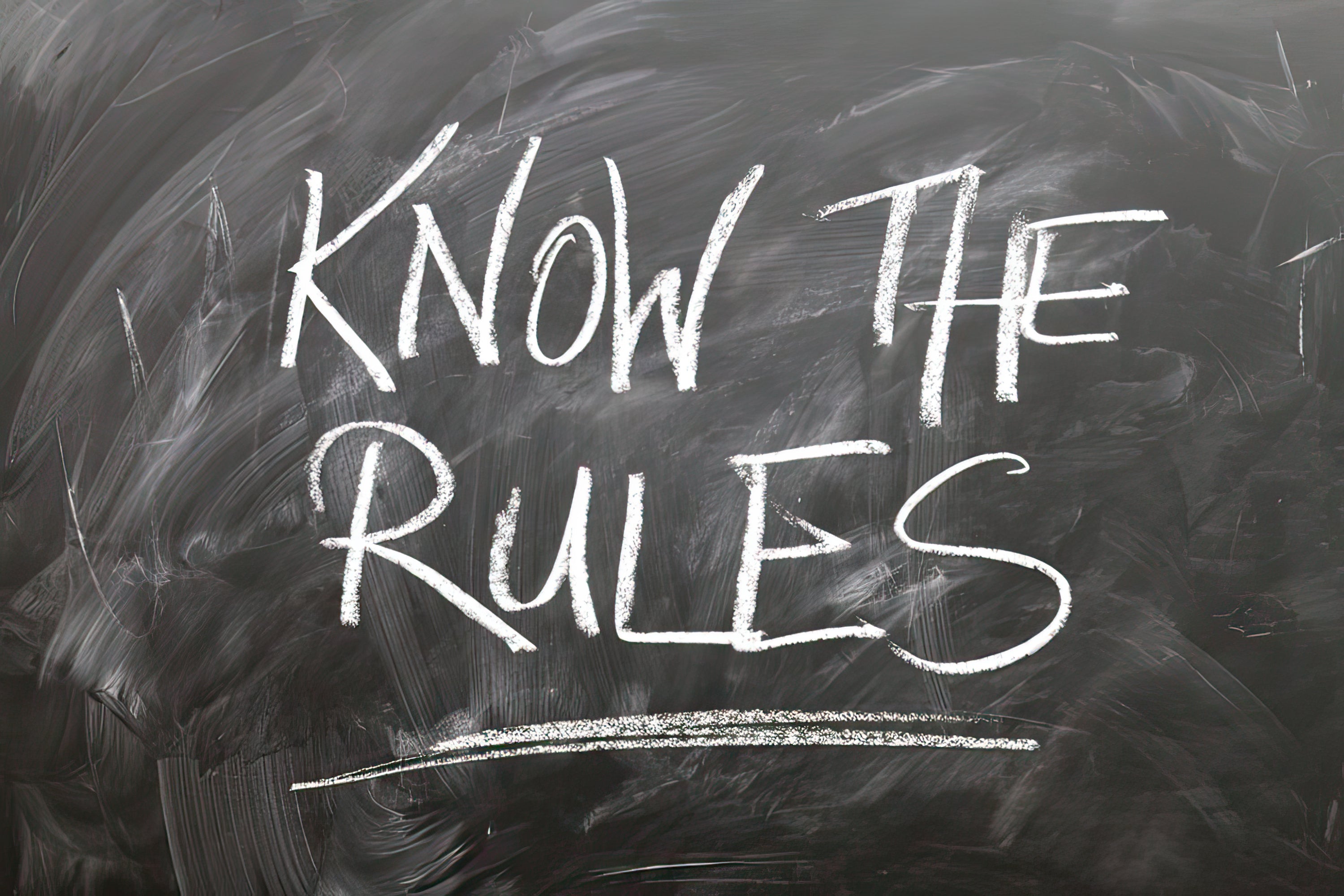 Screenplay Formatting “Rules” When Pitching Your Script - Image of Chalkboard with the words Know The Rules