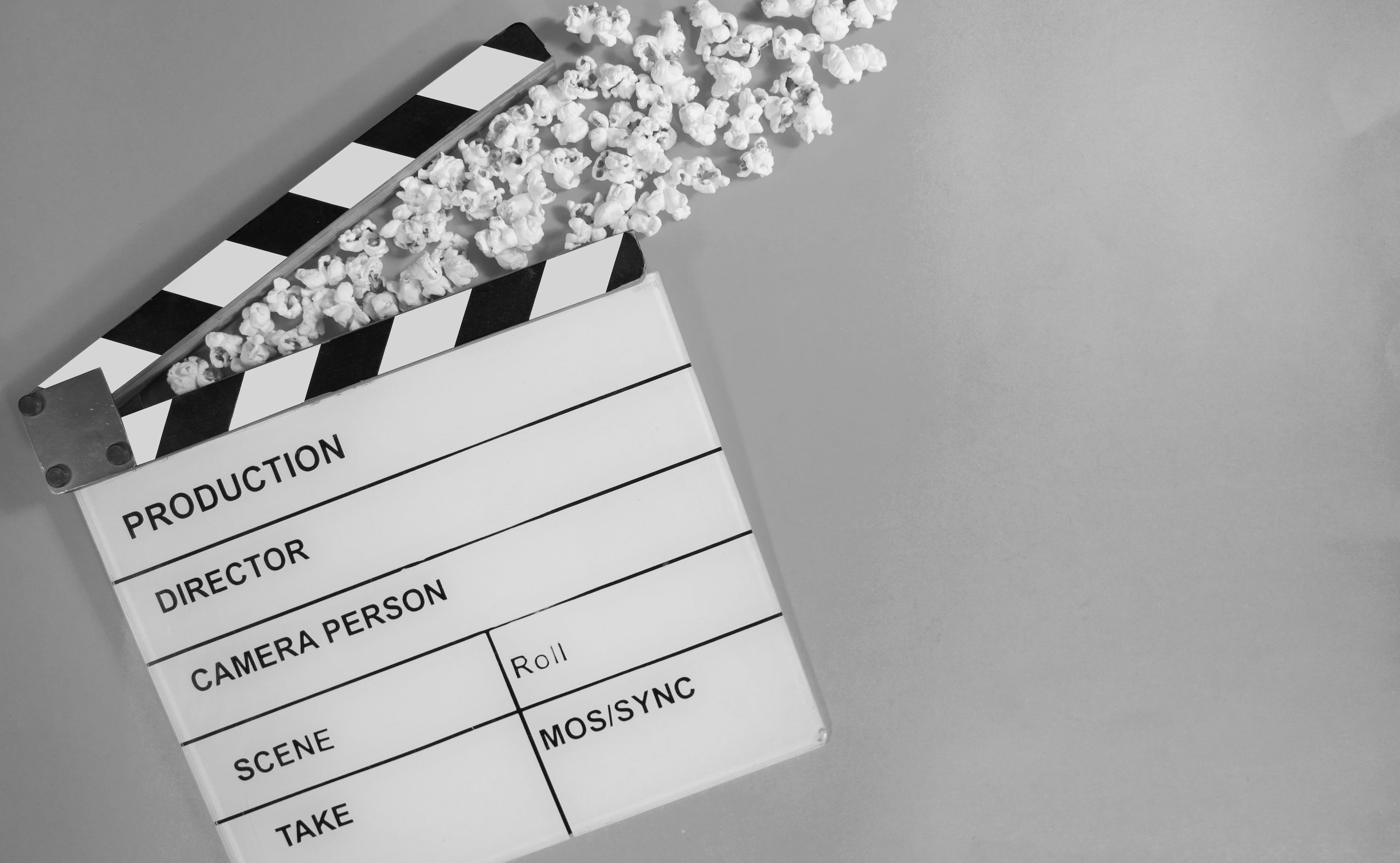 Independent Filmmaker Interviews - Image of Movie Clapboard and Popcorn