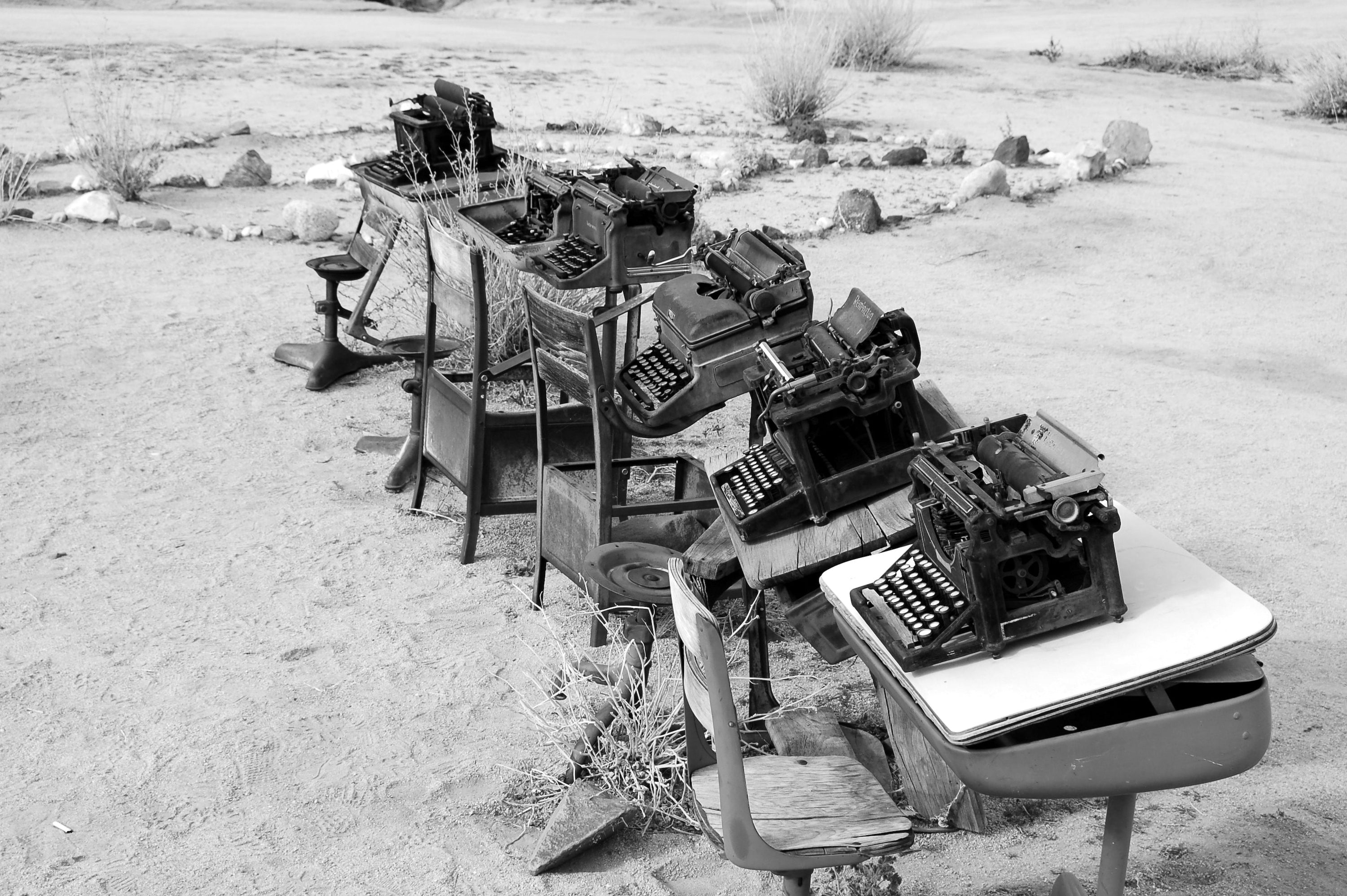Writing True Stories A Brief Guide to Crafting Narrative Nonfiction - Image of Vintage Typewriters on Old School Desks in the Desert